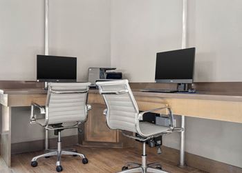 two chairs in front of two monitors in an office at South Lamar Village, Austin, TX, 78704